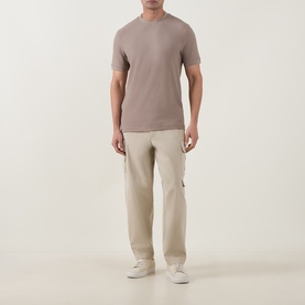 Model wearing Boss Black Casual Open Brown crew neck T-shirt, styled with cream cargo trousers and white trainers.