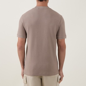 Model wearing Boss Black Casual Open Brown crew neck T-shirt, textured knit fabric, short sleeves, back view, styled with beige cargo trousers.