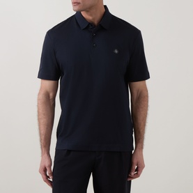 Model wearing Boss Black Casual C-Parris Double B Logo Polo Shirt in dark blue, with polo collar, short sleeves and button fastenings
