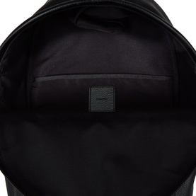 Calvin Klein black backpack interior view showing main compartment lining and branded label patch