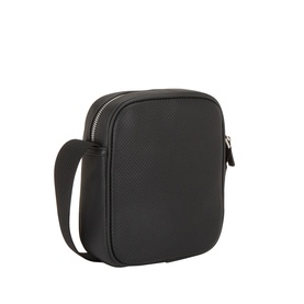 Calvin Klein black crossbody bag in textured polyurethane, silver zip hardware, adjustable shoulder strap, structured square silhouette