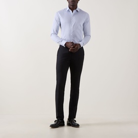Model wearing Calvin Klein Geometric Single-Cuff Shirt in Blue Geo, slim fit with classic collar, styled with black trousers and black shoes.
