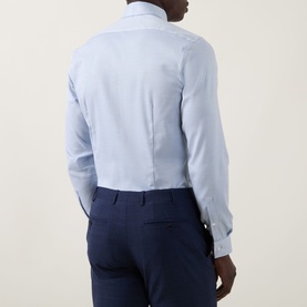 Model wearing Calvin Klein Blue Check Slim Fit Non-Iron Shirt, back view, styled with navy suit trousers.