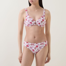 Model wearing Seafolly Summer Chintz Retro Bikini Bottoms in ecru floral print, styled with matching underwire bikini top.