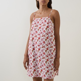 Model wearing Seafolly ecru linen-viscose mini dress with red floral print, thin adjustable straps and relaxed silhouette.