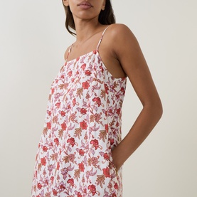 Model wearing Seafolly ecru linen-viscose dress with red floral print, spaghetti straps and relaxed silhouette
