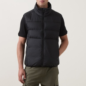 Model wearing Boss Green Label Black Gilet with funnel neck and quilted panels, styled with black tee and khaki cargo trousers