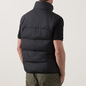 Model wearing Boss Green Label black quilted polyester gilet, styled with a black polo shirt and olive trousers, rear view.