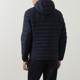 Model wearing Boss Green Label dark blue quilted hooded jacket, shown from rear, styled with matching navy trousers.