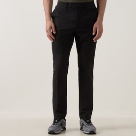 Model wearing Boss Green Label Goc Swing Water-Repellent Trousers in black, styled with grey trainers