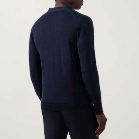 Model wearing John Smedley Bradrick Fine Knit Cardigan in navy, back view showing fine merino wool knit, long sleeves and ribbed trims