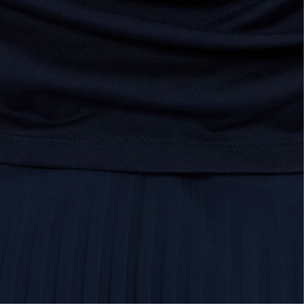 Claude Pierlot blue womenswear top and pleated skirt co-ord, navy fabric detail showing draped bodice and knife-pleat skirt