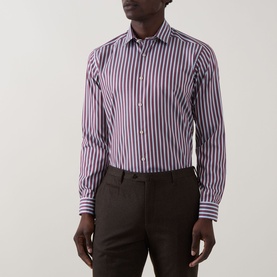 Model wearing Eton Bengal Stripe Single-Cuff Shirt in dark red, featuring cut-away collar and long sleeves, styled with dark brown trousers