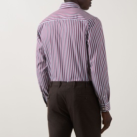 Model wearing Eton Bengal Stripe Single-Cuff Shirt in dark red, rear view, styled with dark brown trousers.