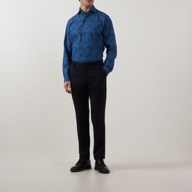 Model wearing Eton Floral Denim Shirt in denim blue with cut-away collar and long sleeves, styled with dark navy trousers and black shoes.