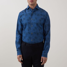 Model wearing Eton Floral Denim Shirt in denim blue with tonal floral print, cut-away collar and long sleeves, styled with black trousers