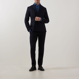 Model wearing Eton Floral Denim Shirt in denim with cut-away collar, styled with navy blazer, matching trousers and black leather shoes.