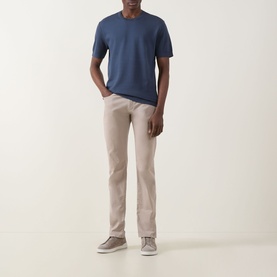 Model wearing Eton Dark Blue cotton crew neck T-shirt, styled with stone chinos and grey trainers