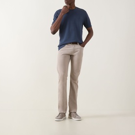 Model wearing Eton Dark Blue cotton crew neck T-shirt, styled with beige trousers and grey suede trainers.