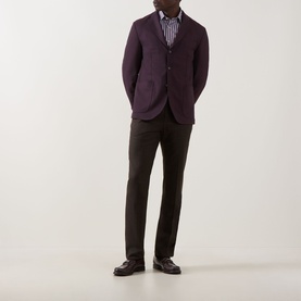 Model wearing Eton Lana Tech Single-Breasted Blazer in dark red, styled with striped shirt and dark trousers