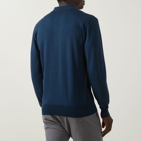 Model wearing Eton Chevron Structure Polo Shirt in mid blue, rear view, long sleeves and ribbed hem visible, paired with grey trousers