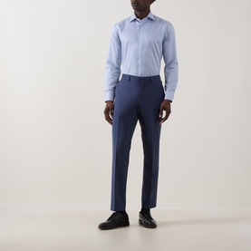 Model wearing Eton Bengal Stripe Single-Cuff Shirt in teal, cut-away collar, styled with navy tailored trousers and black shoes.