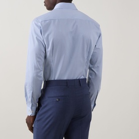 Model wearing Eton Bengal Stripe Single-Cuff Shirt in teal, rear view, styled with navy tailored trousers.