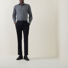Model wearing Eton Geometric Print Single-Cuff Shirt in navy blue with cut-away collar, styled with slim black trousers and black dress shoes