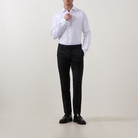 Model wearing Eton Solid Single-Cuff Shirt in white with cut-away collar, styled with black slim-fit trousers and black shoes.