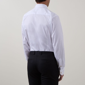 Model wearing Eton Solid Single-Cuff Shirt in white, rear view, with cut-away collar and single cuffs, styled with black trousers.