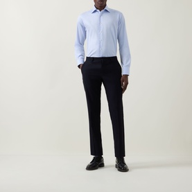 Model wearing Eton Light Blue Single Cuff Slim shirt in 100% cotton, styled with navy tailored trousers and black dress shoes.