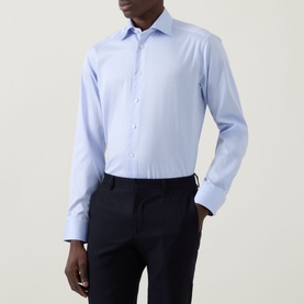 Model wearing Eton Light Blue Single Cuff Slim formal shirt, styled with navy tailored trousers