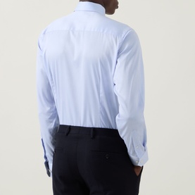 Model wearing Eton Light Blue Single Cuff Slim formal shirt, rear view, styled with navy trousers