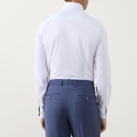 Model wearing Eton Twill Single Cuff Shirt in white, back view, styled with blue tailored trousers. Single cuffs and slim fit visible.