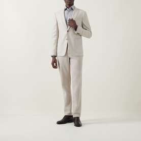 Model wearing Eton Micro Print Single-Cuff Shirt in Navy Blue, styled with a stone suit jacket and matching trousers, dark leather shoes.