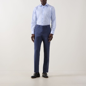 Model wearing Eton Prince of Wales Check Shirt in light blue, single cuff, cut-away collar, styled with navy trousers and black dress shoes.