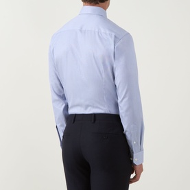 Model wearing Eton Dark Blue Single Cuff Slim formal shirt, back view, styled with navy tailored trousers.