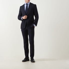 Model wearing Eton Dark Blue Single Cuff Slim formal shirt, styled with a navy suit, tie, and black dress shoes.
