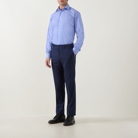 Model wearing Eton Mid Blue Single Cuff Regular formal shirt in 100% cotton, styled with navy trousers and black shoes.