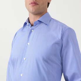 Model wearing Eton Mid Blue Single Cuff Regular formal shirt in 100% cotton, close-up showing spread collar and button placket detail.