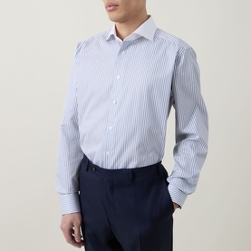 Model wearing Eton light blue stripe cotton formal shirt, single cuff regular fit, styled with navy trousers