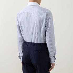 Model wearing Eton Light Blue striped cotton formal shirt, single cuff regular fit, shown from behind with navy trousers