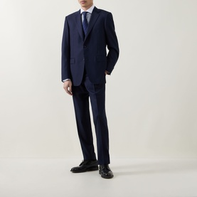 Model wearing Eton Light Blue Single Cuff Regular cotton shirt, styled with navy suit, tie, and black dress shoes.