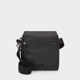 Hugo Boss black polyurethane crossbody bag with front zip pocket, gunmetal hardware, and adjustable fabric shoulder strap