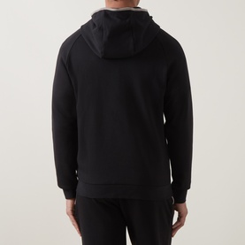 Model wearing Hugo Boss black cotton-blend hoodie, rear view, with matching black joggers