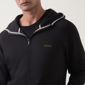 Model wearing Hugo Boss black zip-up hoodie with gold logo, contrast stripe hood trim and crew neck tee underneath.