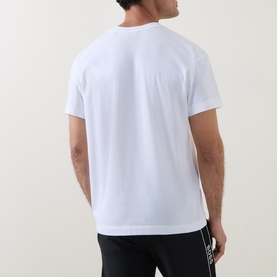 Model wearing Hugo Laze Logo Lounge T-Shirt in white, rear view, crew neck, short sleeves, paired with black joggers