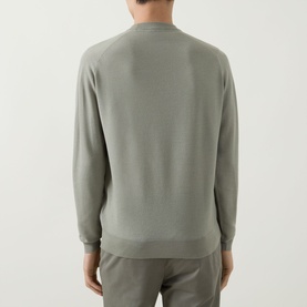 Model wearing John Smedley 15.Singular Knit Sweater in Thistle Drew, back view, crew neck merino wool jumper with ribbed trims and long sleeves.