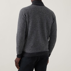 Model wearing John Smedley Inghram Textured Half-Zip Sweater in charcoal, back view showing ribbed hem and textured knit structure