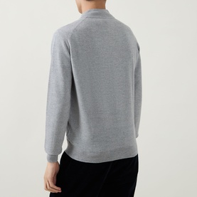 Model wearing John Smedley 16.Singular Extra Fine Knit Jacket in light grey, rear view showing ribbed trims and long sleeves, styled with black